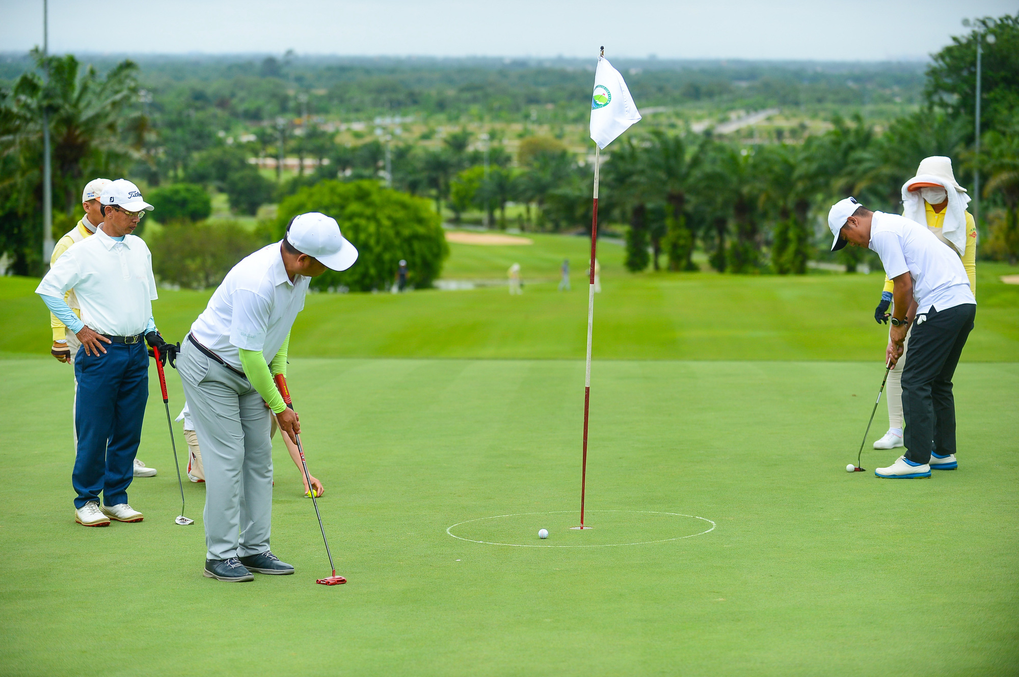 <em>People play golf at a golf course in Vietnam. Photo: </em>Quang Dinh / Tuoi Tre