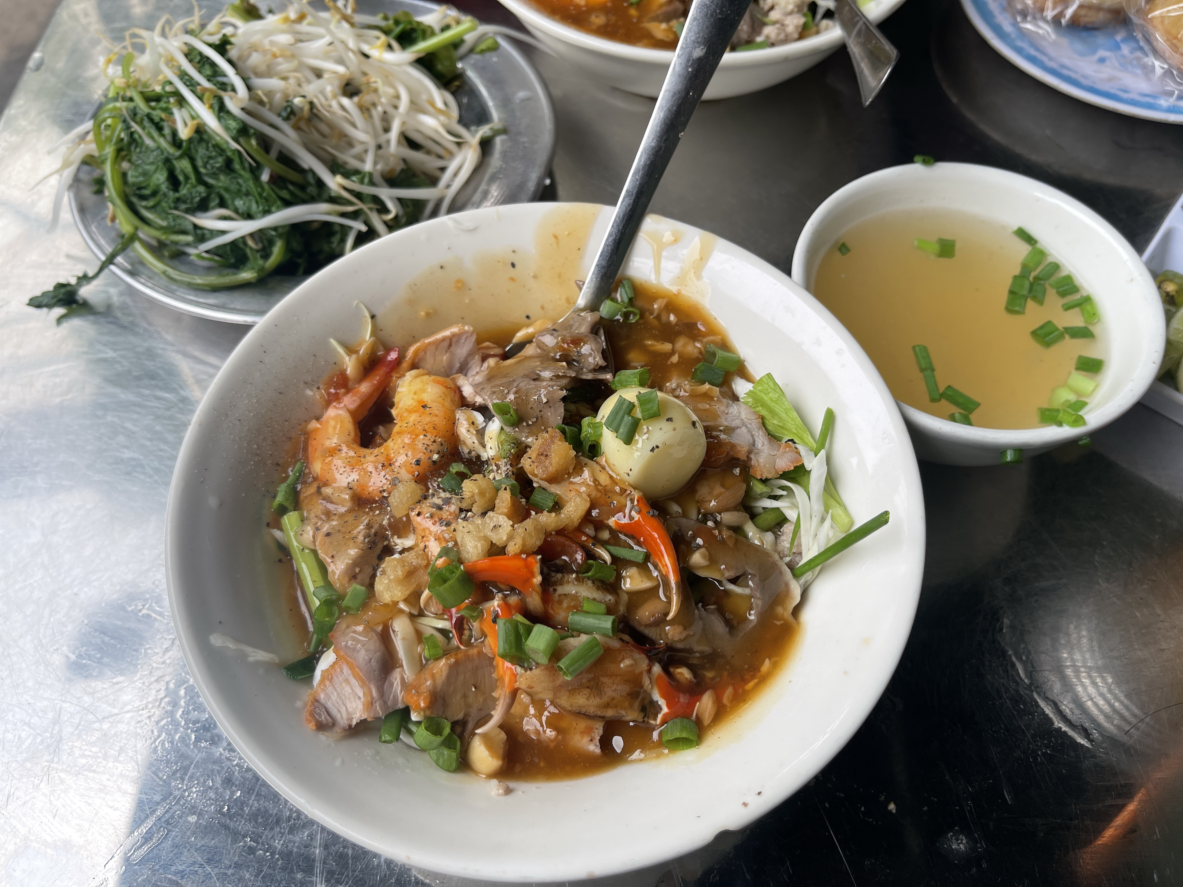 <em>A bowl of </em>hủ tiếu <em>noodles is served at a stall in District 1, Ho Chi Minh City. Photo: </em>Dong Nguyen / Tuoi Tre News