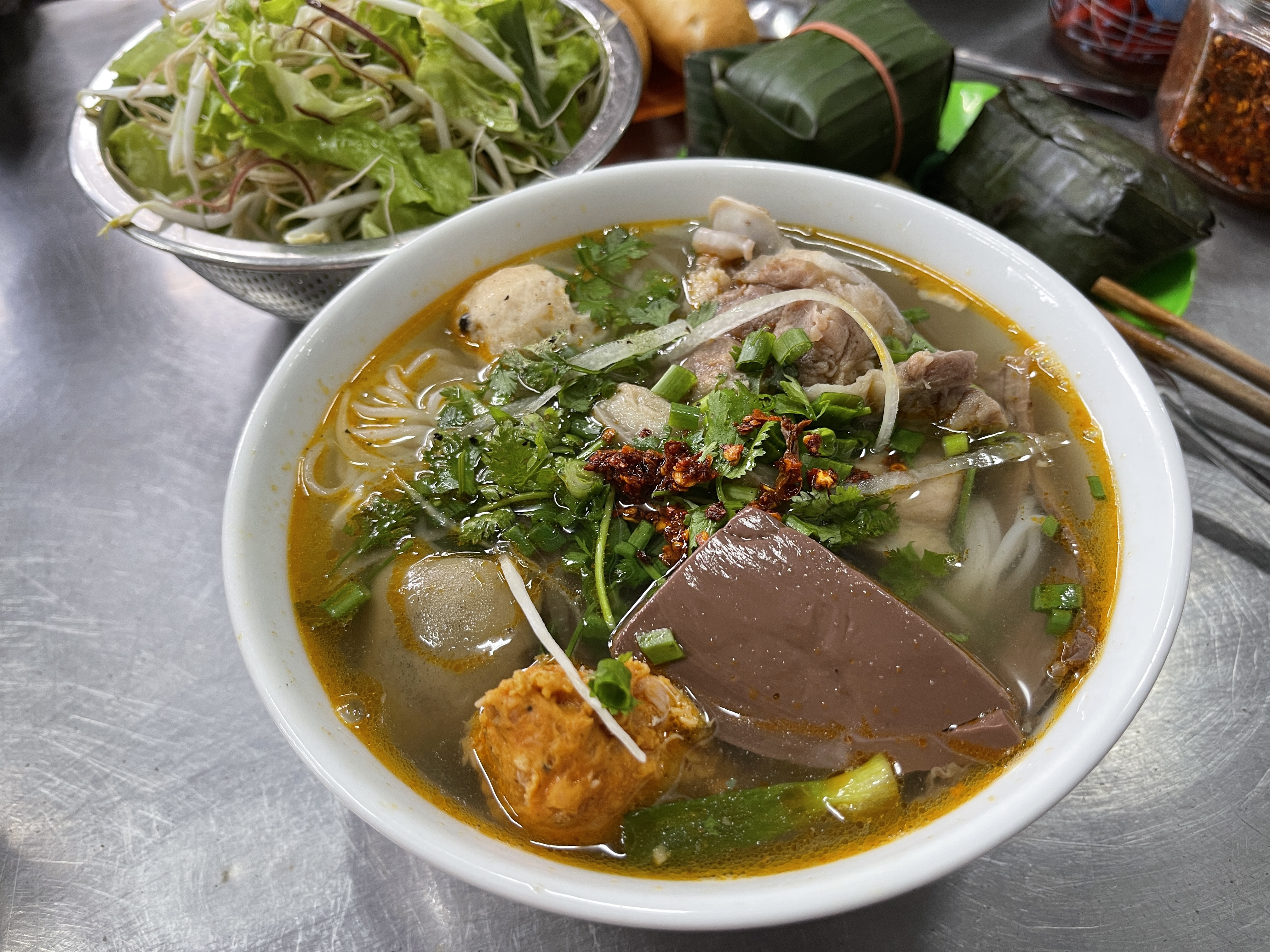 <em>A bowl of </em>bún bò<em> (spicy beef noodles) is served at a shop in the central city of Hue. Photo: </em>Dong Nguyen / Tuoi Tre News