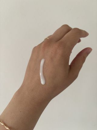 L'Oréal Paris Pure Retinol Revitalift Laser Night Serum texture on the back of Mica's hand