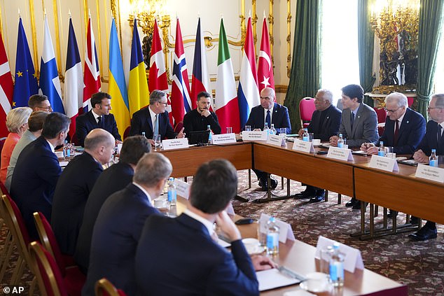 Canada Prime Minister Justin Trudeau, third from right, looks towards Britain's Prime Minister Keir Starmer and Ukrainian President Volodymyr Zelenskyy as they take part in a plenary during the Securing our Future Summit on Ukraine