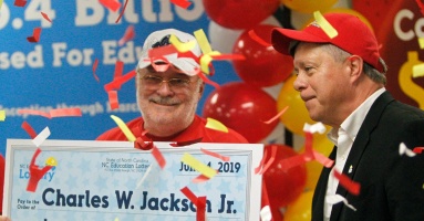 Winner of $1.765 billion Powerball jackpot described as 65-year-old who 'adores his grandchildren'